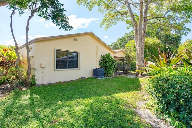 exterior space featuring central AC unit