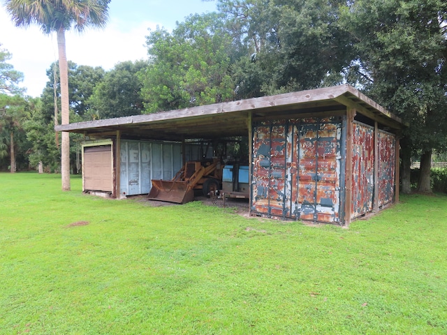 view of outdoor structure with a lawn