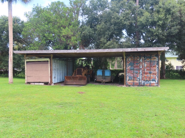 view of outbuilding featuring a lawn