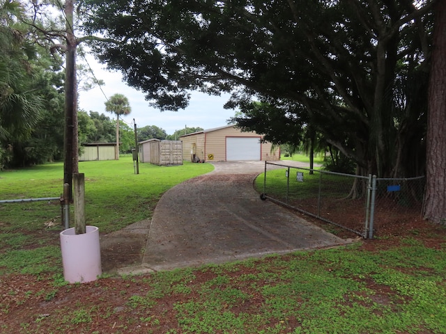 view of yard featuring a shed and a garage