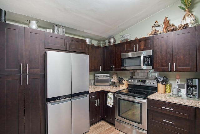 kitchen featuring light hardwood / wood-style flooring, dark brown cabinets, and appliances with stainless steel finishes