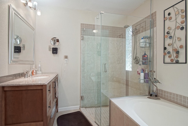 bathroom featuring independent shower and bath and vanity