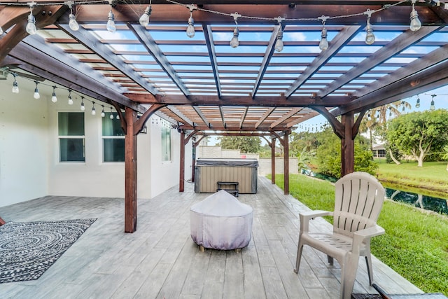 view of patio with a pergola and a hot tub