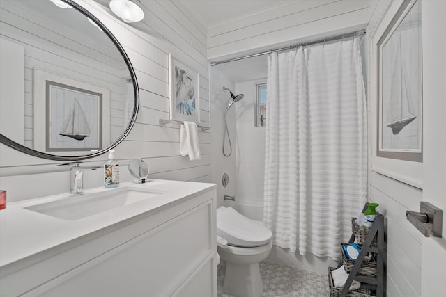 full bathroom with toilet, vanity, shower / tub combo with curtain, and wooden walls