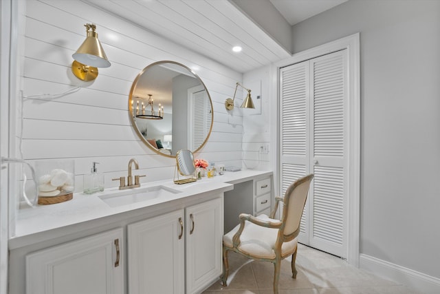 bathroom with tile patterned flooring and vanity