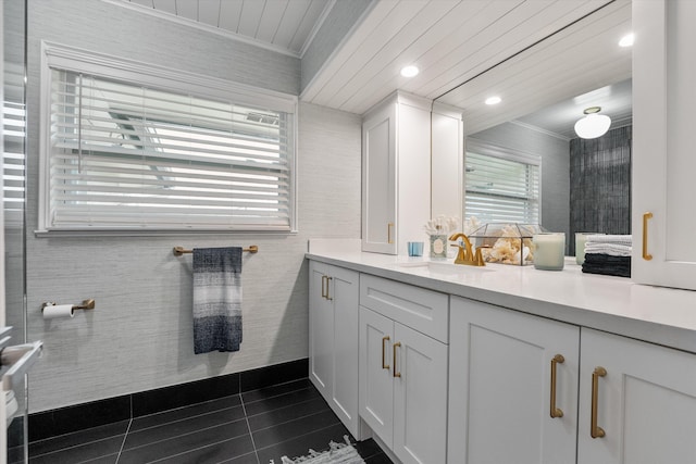 bathroom with tile patterned flooring, vanity, wood ceiling, and crown molding