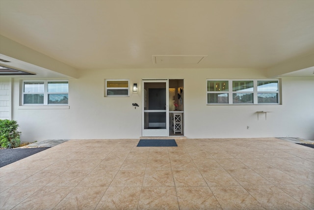 doorway to property with a patio area