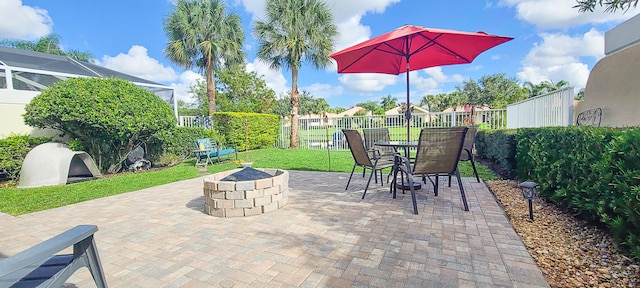 view of patio with an outdoor fire pit