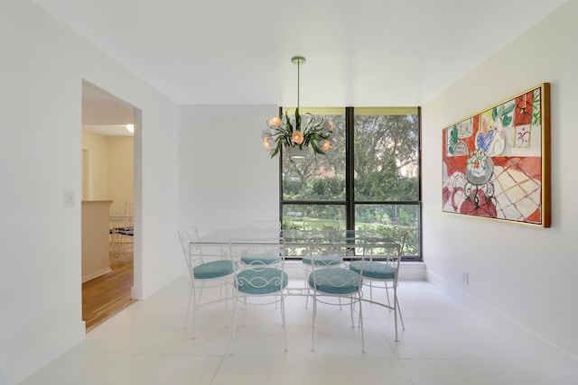 dining space featuring light hardwood / wood-style floors and expansive windows