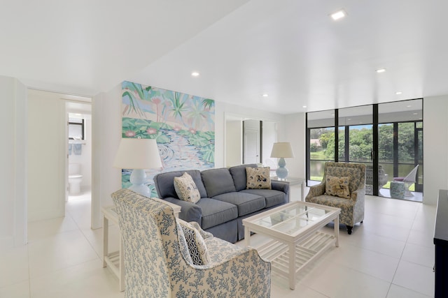 living room with light tile patterned floors and expansive windows