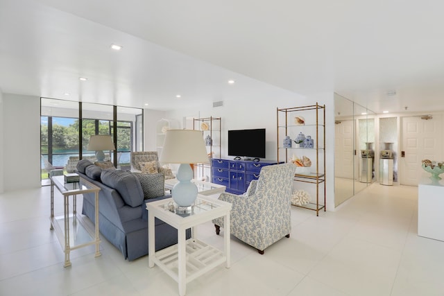 living room with floor to ceiling windows