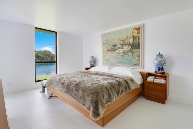 bedroom featuring light tile patterned floors