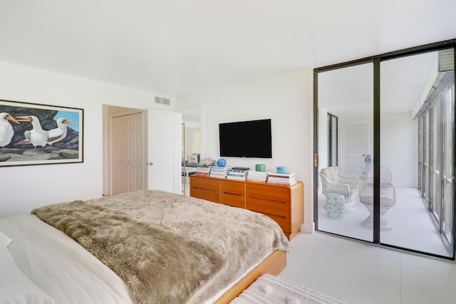 bedroom featuring a closet and access to exterior