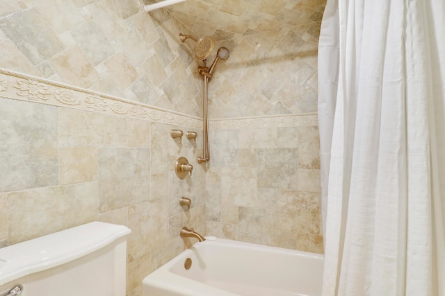 bathroom featuring shower / bath combination with curtain and toilet