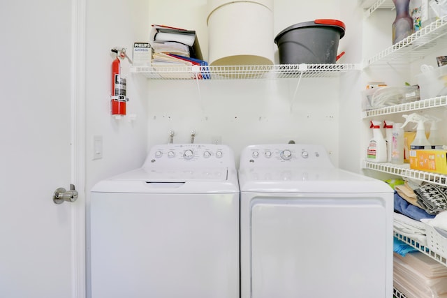 laundry area with separate washer and dryer