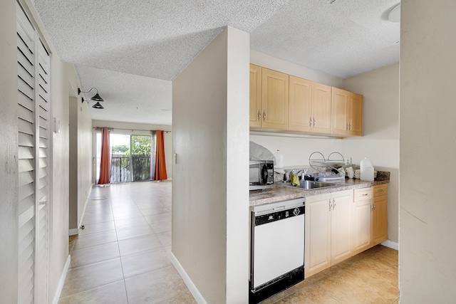 kitchen with light tile patterned flooring, white dishwasher, a textured ceiling, light brown cabinetry, and sink