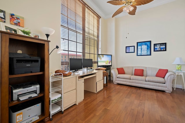 office with crown molding, hardwood / wood-style floors, and ceiling fan