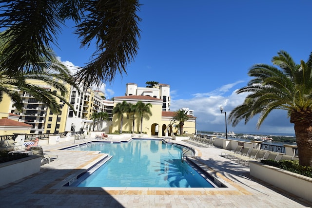 view of swimming pool with a patio