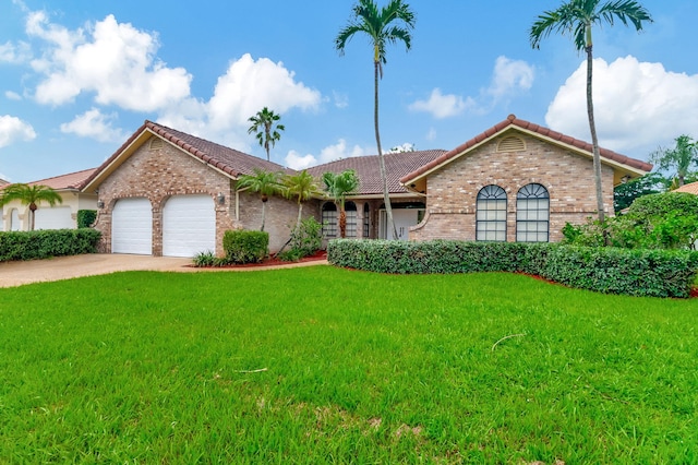 ranch-style home with a front yard and a garage