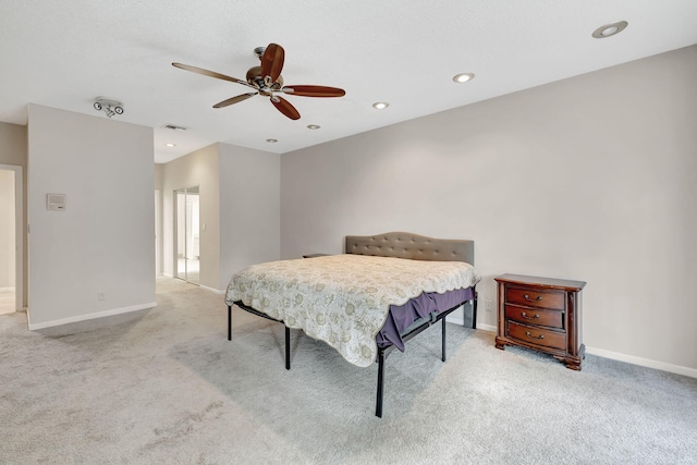 bedroom with light carpet and ceiling fan