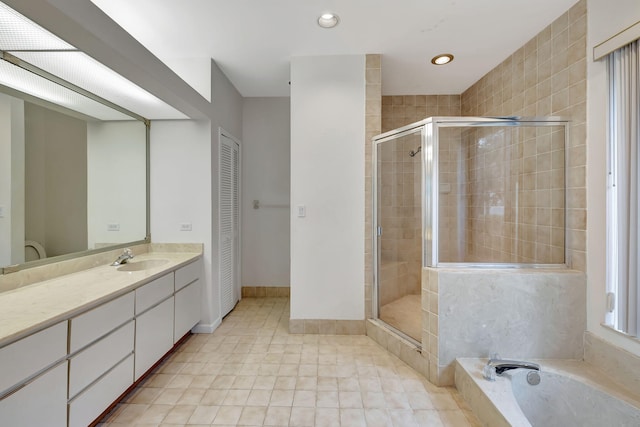 bathroom featuring vanity and separate shower and tub