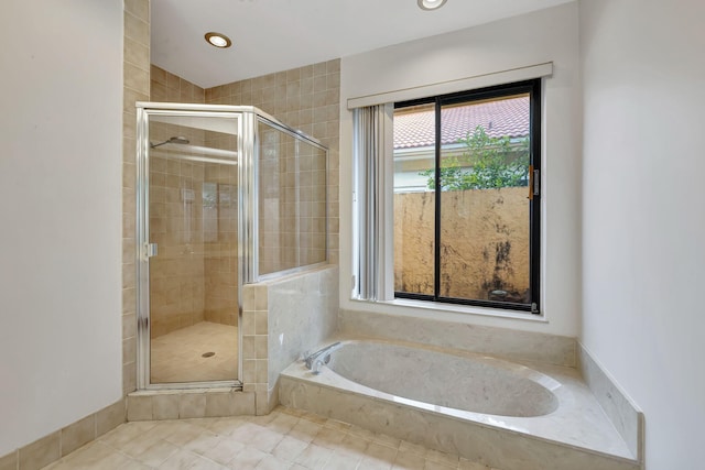 bathroom featuring independent shower and bath and tile patterned floors