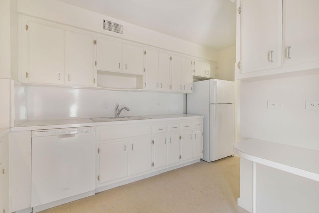 kitchen featuring white cabinetry, white appliances, and sink