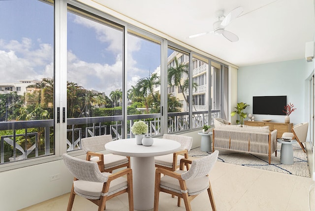 sunroom featuring plenty of natural light and ceiling fan