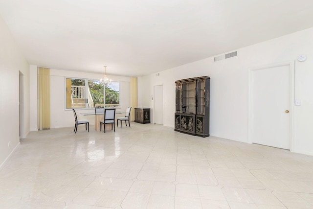 389 S Lake Dr Unit 2H, Palm Beach, FL 33480 - empty room featuring a chandelier, a smoke detector, light tile patterned floors, and baseboards