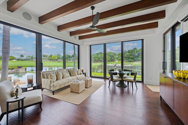 sunroom with a water view, ceiling fan, beamed ceiling, and a wall unit AC