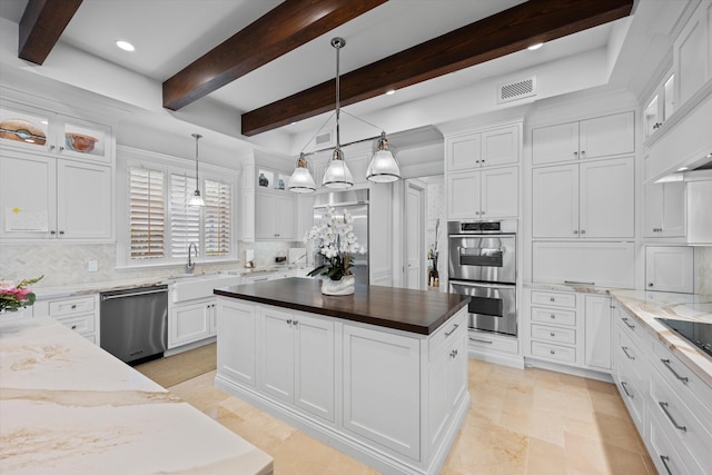 kitchen featuring white cabinetry and stainless steel appliances