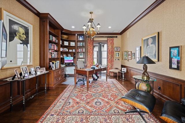 office with ornamental molding, built in shelves, a notable chandelier, and dark wood-type flooring