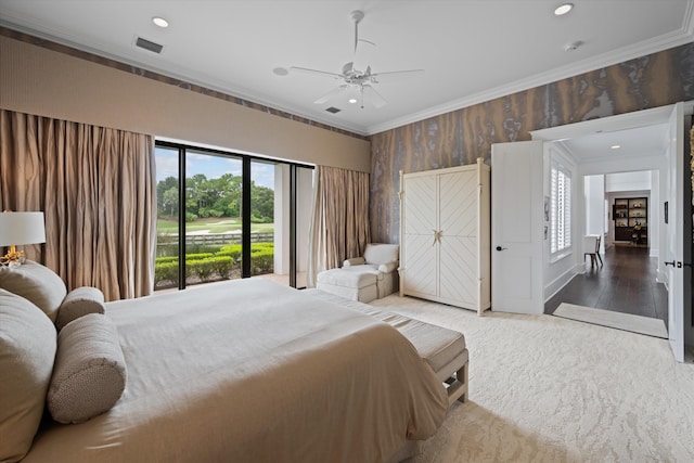 bedroom with ceiling fan, ornamental molding, and hardwood / wood-style floors