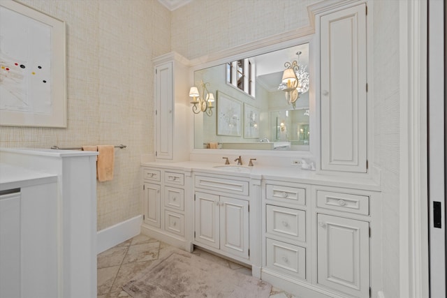 bathroom with crown molding and vanity