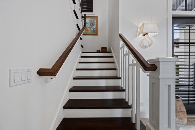 stairway featuring hardwood / wood-style flooring