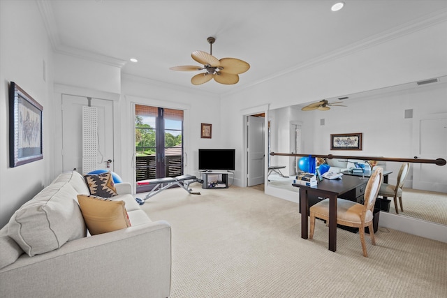 carpeted living room with ornamental molding and ceiling fan