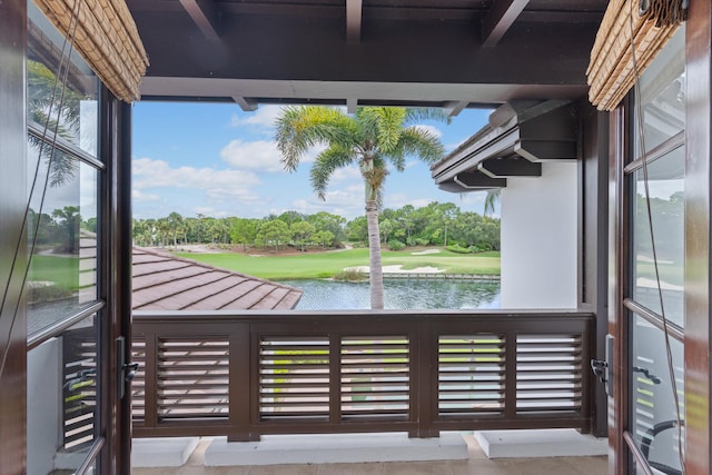 balcony featuring a water view