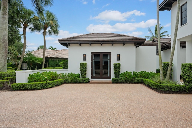 entrance to property featuring french doors