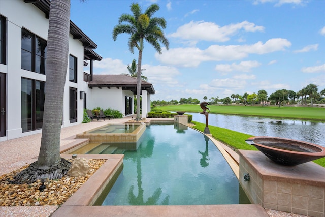 view of swimming pool featuring a patio, a water view, and an in ground hot tub