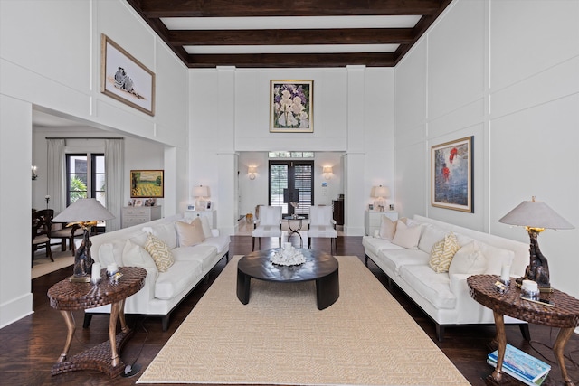 living room with french doors, beam ceiling, and dark wood-type flooring