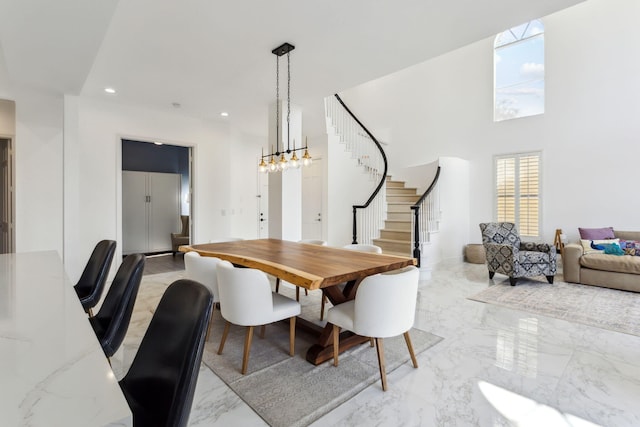 dining area featuring a high ceiling