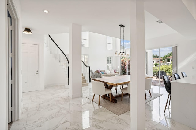 dining space with a notable chandelier