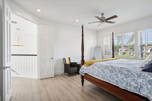 bedroom with light wood-type flooring and ceiling fan