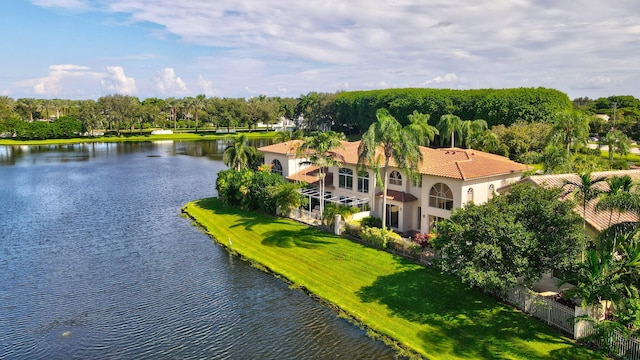 birds eye view of property with a water view