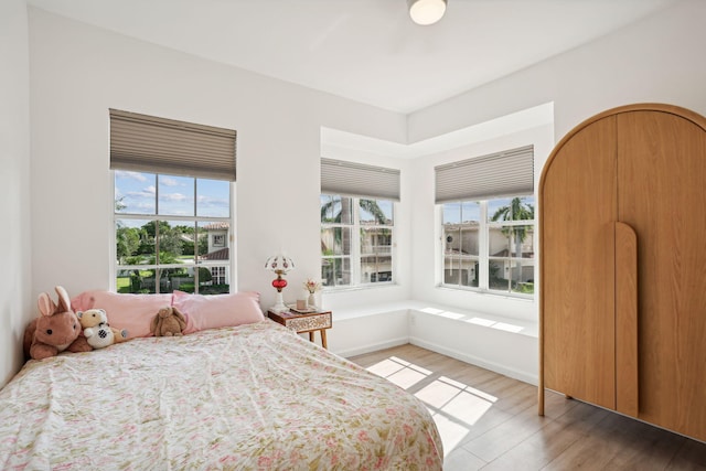 bedroom with light hardwood / wood-style floors