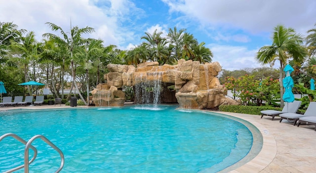 view of swimming pool featuring pool water feature