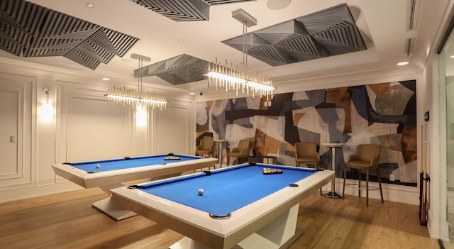 recreation room with pool table and hardwood / wood-style flooring