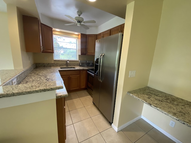 kitchen with ceiling fan, light tile patterned floors, sink, and appliances with stainless steel finishes