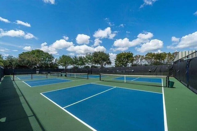 view of sport court with basketball hoop