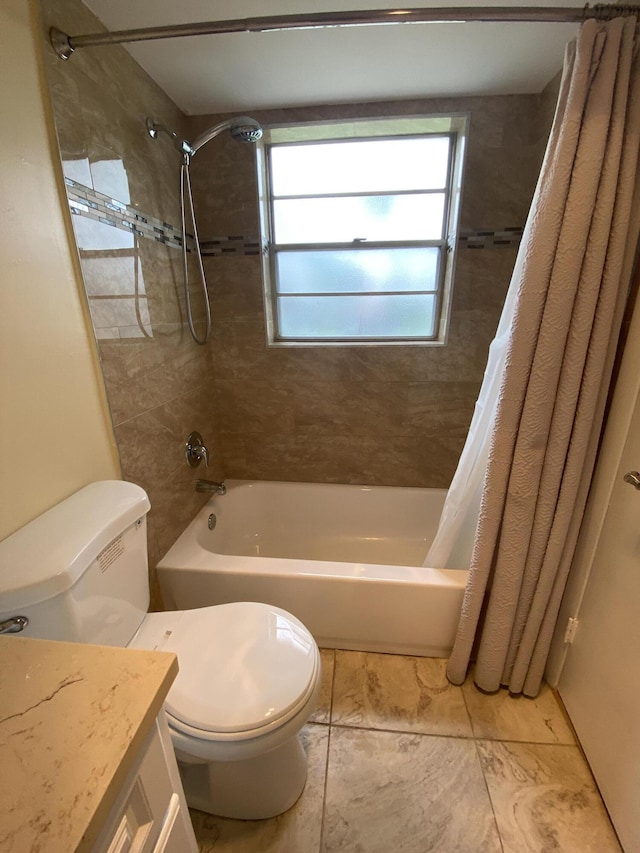 full bathroom featuring vanity, shower / tub combo, and toilet